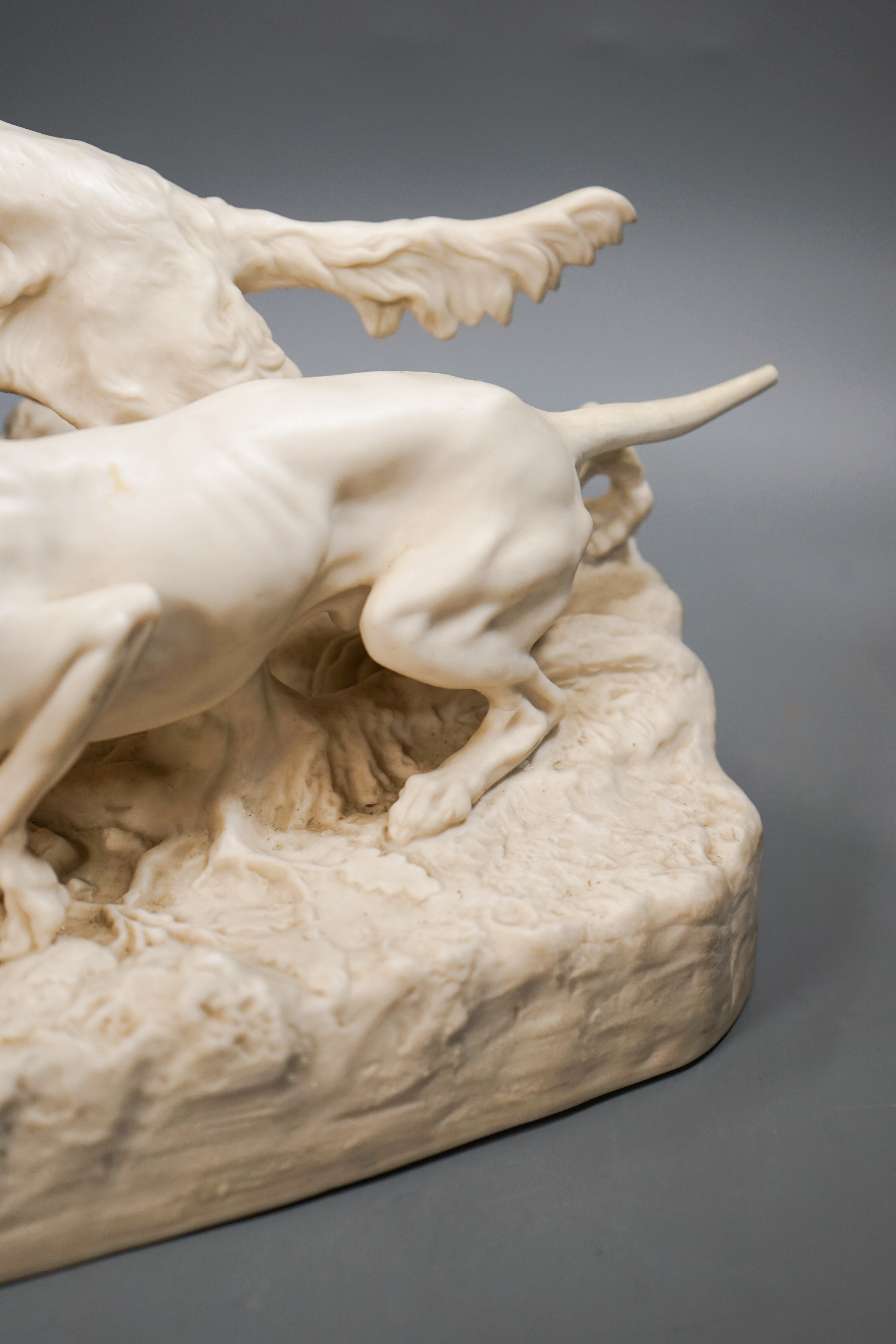 A Victorian parian group of two setters flushing a partridge, after Mene, 32cm (a.f.)
